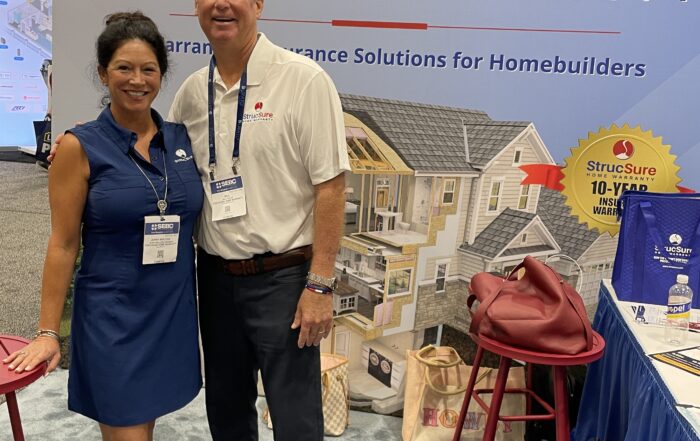 Jenny Malone Wiseman, Vice President of Sales, Florida, and Bill Flack, Executive Vice President of National Sales and Product, at the StrucSure Home Warranty booth during the 2026 Southeast Building Conference (SEBC) in Orlando, Florida.